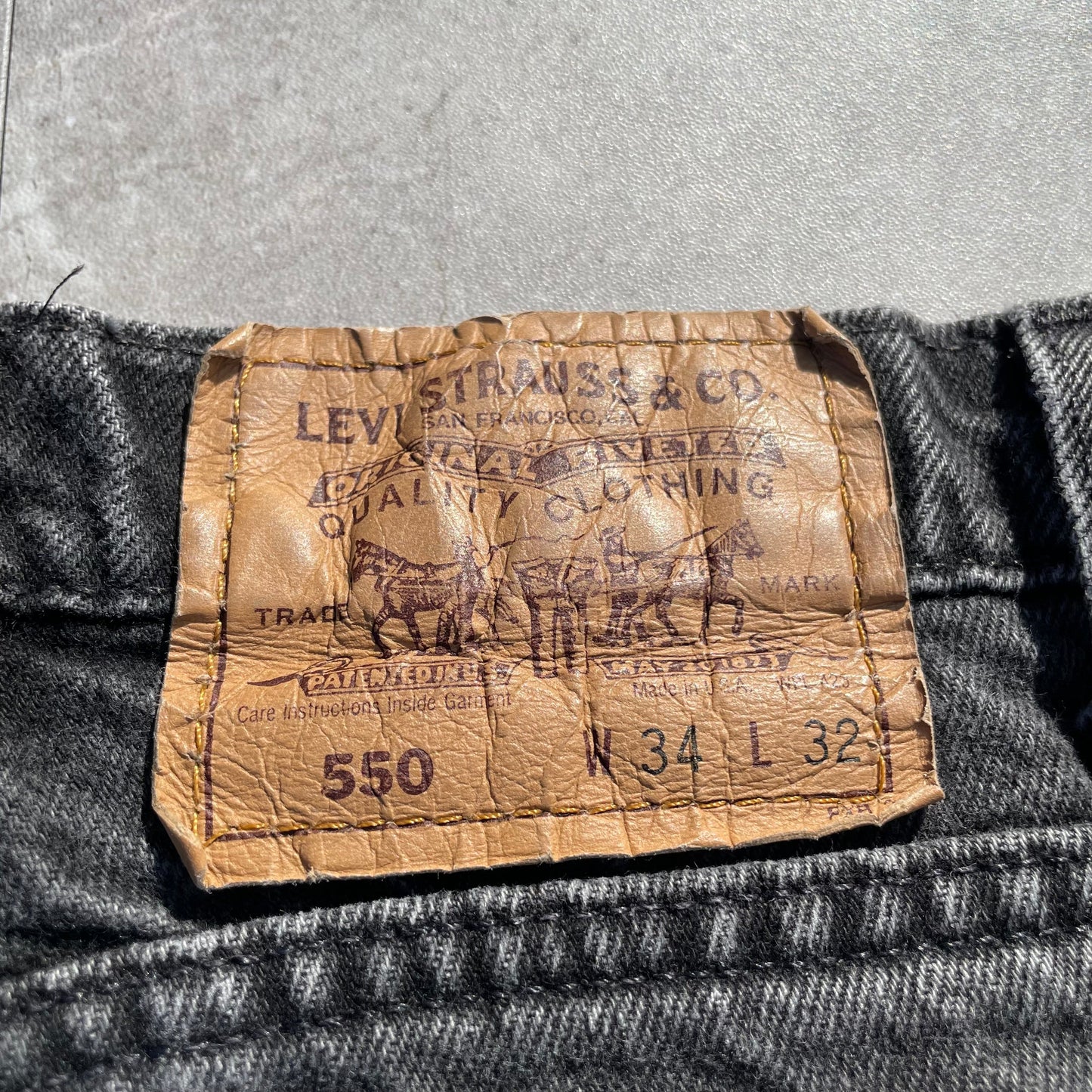 90s Levi's 550 Orange Tab Made in USA Black Denim 34x32 KiiChain Clothing
