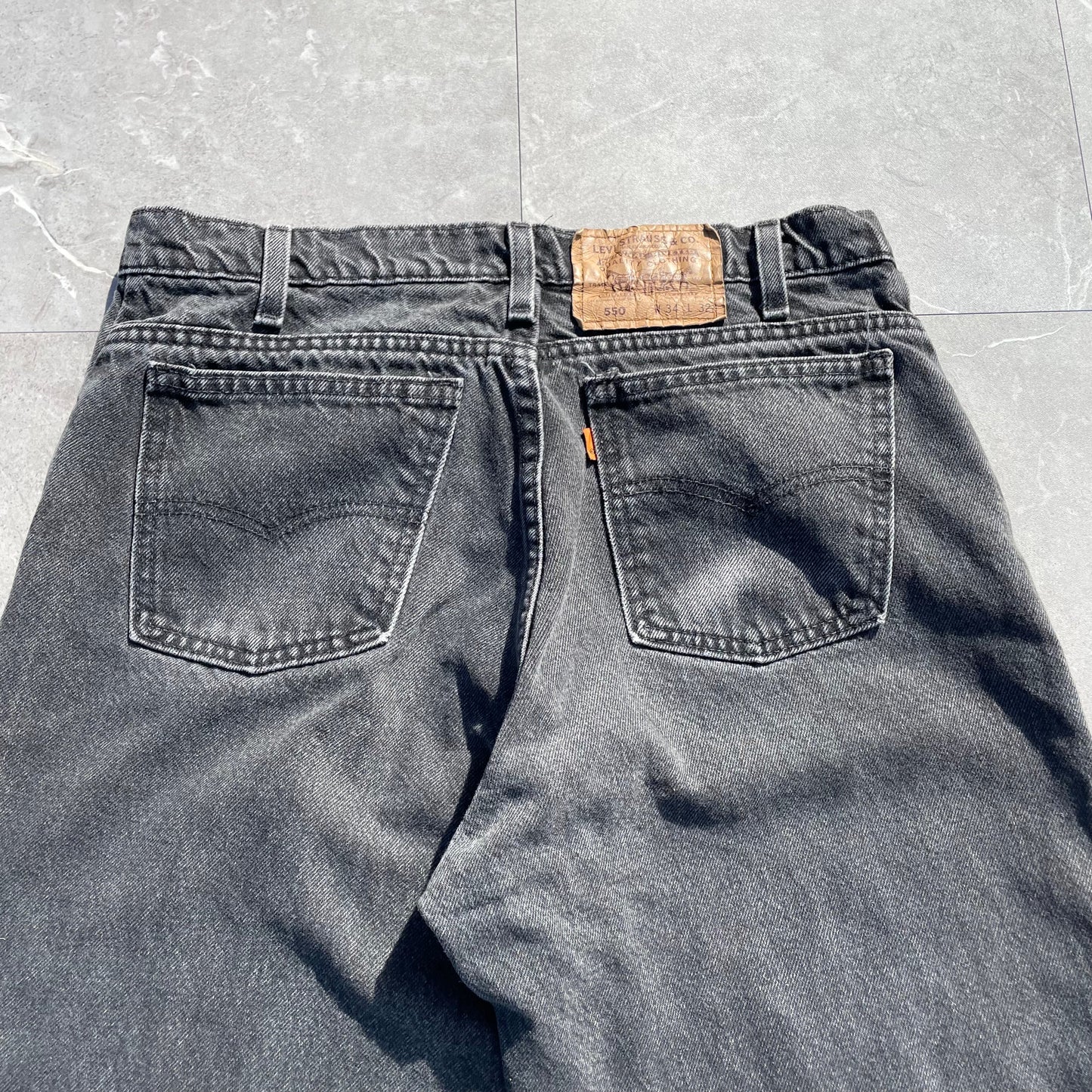 90s Levi's 550 Orange Tab Made in USA Black Denim 34x32 KiiChain Clothing
